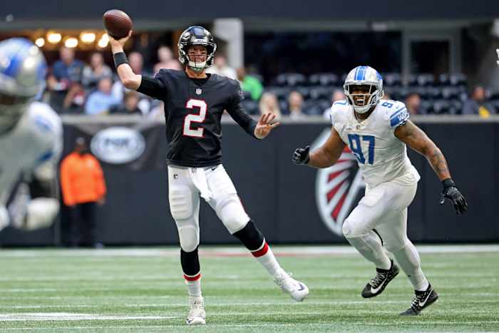 Dec 26, 2021; Atlanta, Georgia, USA; Atlanta Falcons quarterback Matt Ryan (2) attempts a pass against Detroit Lions defensive end Nick Williams (97) during the fourth quarter at Mercedes-Benz Stadium. Mandatory Credit: Jason Getz-USA TODAY Sports